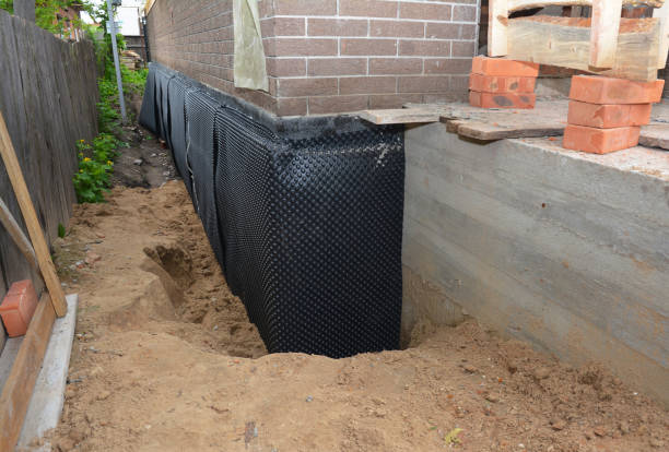 Happy homeowners after waterproofing job in Fredericktown